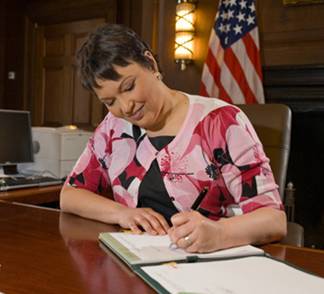 EPA Administrator Lisa Jackson signing the finding