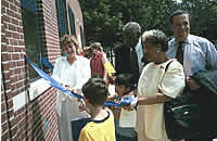 Ribbon cutting at grand opening ceremony of  "r" Kids Family Center. Click for a larger image.