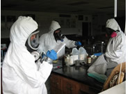 EPA personnel assess a chemistry lab at a high school in Bay St. Louis, Miss.
