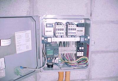 The photo shows the open control box displaying the electronic components. 