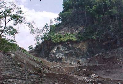 The photo shows a close up view of an excavated mountain area.
