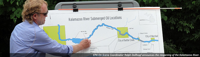 EPA On-Scene Coordinator Ralph Dollhopf announces the opening of the Kalamazoo River.