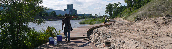 Workers build a riverwalk along Burns Harbor in northwest Indiana