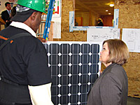 workers insatlling solar panels
