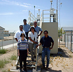 Photo of: Gila River Indian Community Air Quality Staff is standing in front of one of their monitoring sites