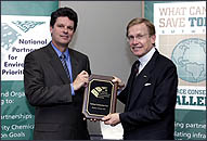 Photo of Northrup executive receiving plaque