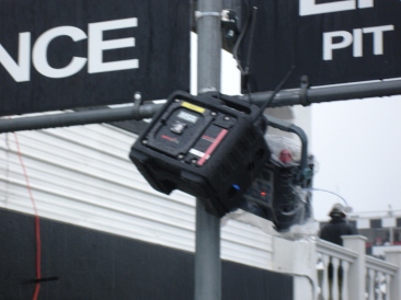 small fixed monitor hanging above entrance to pit area