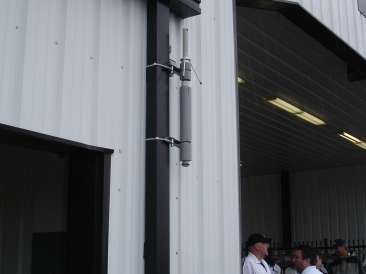 long, thin monitoring device mounted to wall in NASCAR garage area
