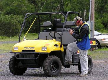 four-wheel drive vehicle used to move staff around the track