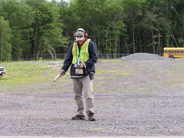 EPA responder using handheld monitoring instrument