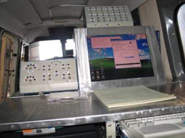 Close-up of the operation station inside the plane, computer monitor and instruments