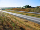 erosion control at highway project site using compost blanket