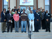 Students and EPA-Howard University alumni pose on steps at the university