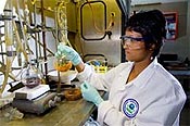 photo of EPA woman scientist holding lab equipment